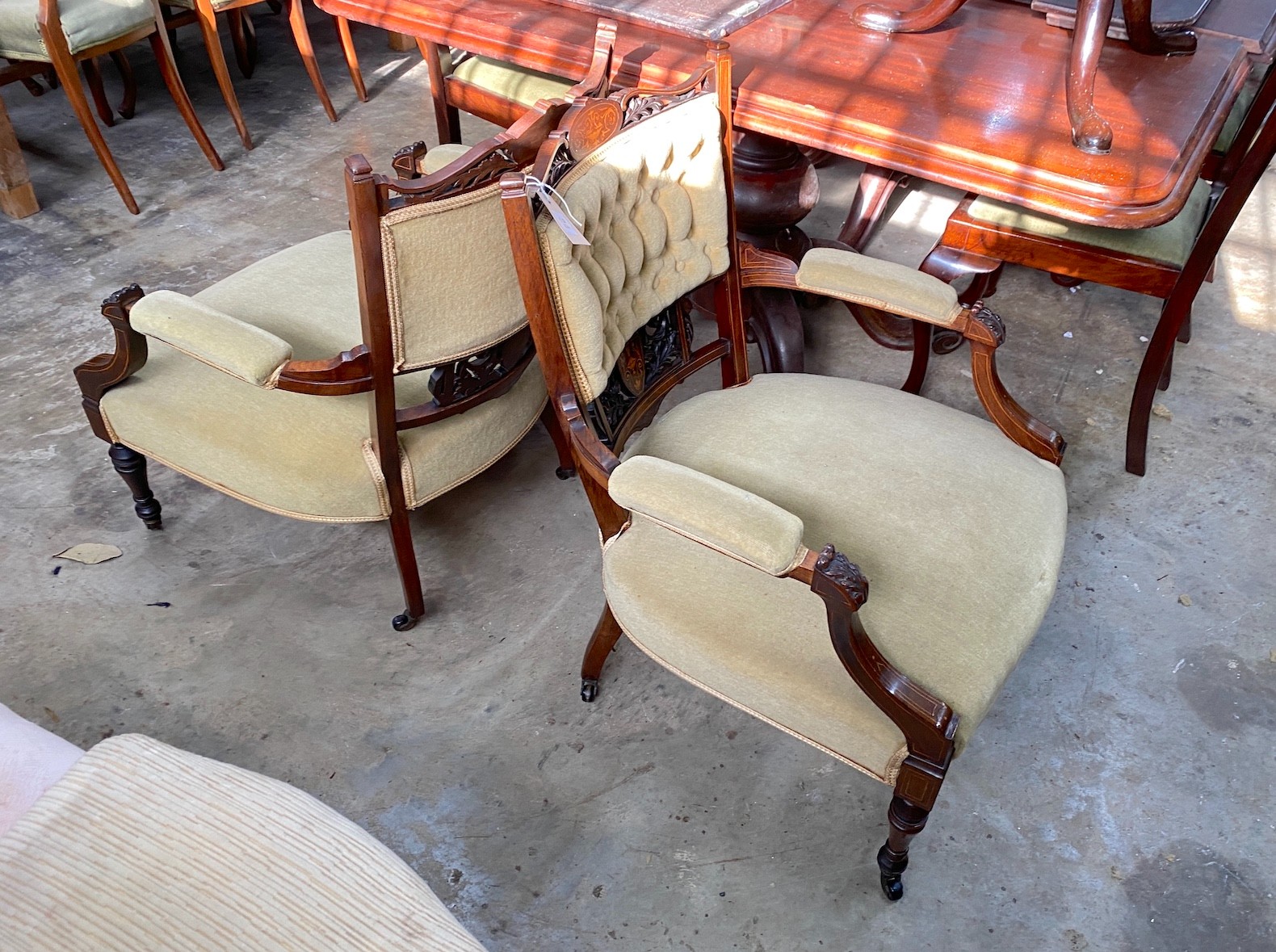 A pair of late Victorian inlaid rosewood salon chairs, width 63cm, depth 60cm, height 80cm