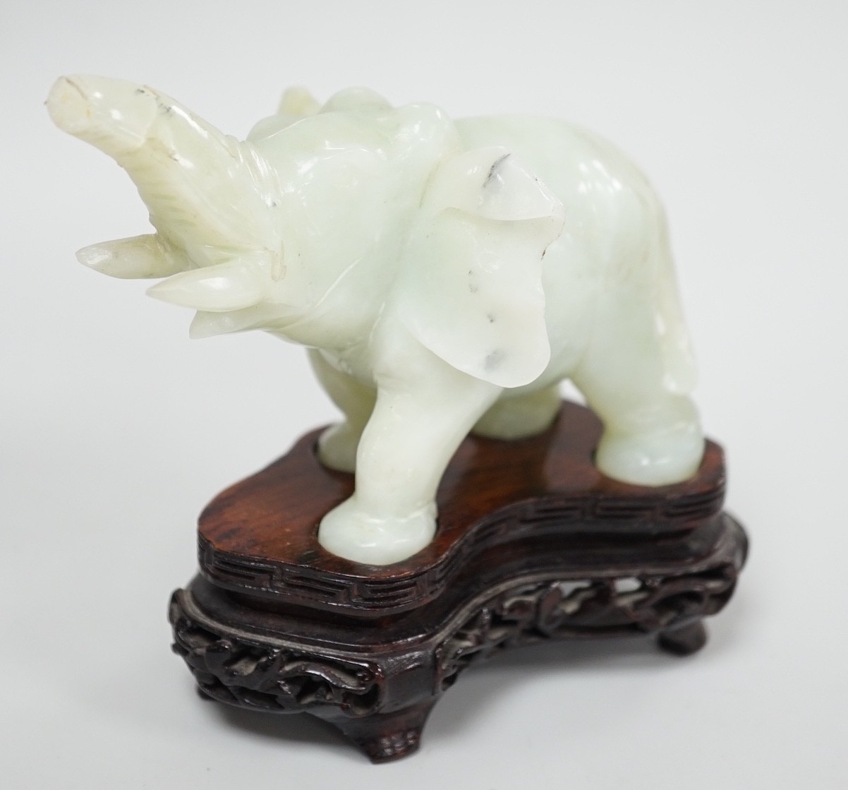 A Chinese bowenite jade elephant on hard wood stand, 11cm tall - Image 5 of 8