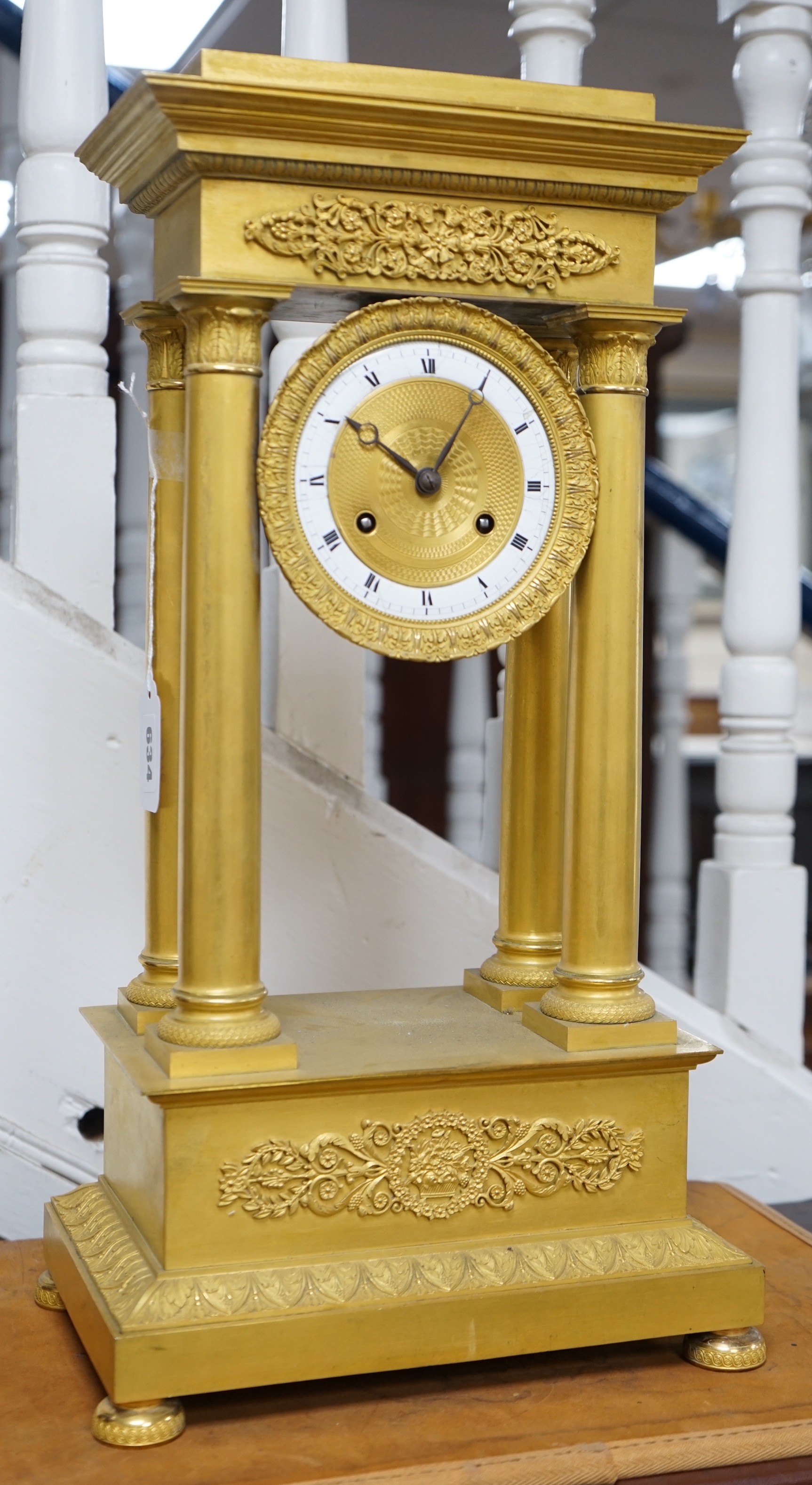 A large mid 19th century French ormolu portico clock. 49cm tall
