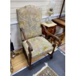 A pair of Louis XIII style walnut tapestry open armchairs, width 65cm, depth 62cm, height 116cm