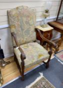 A pair of Louis XIII style walnut tapestry open armchairs, width 65cm, depth 62cm, height 116cm
