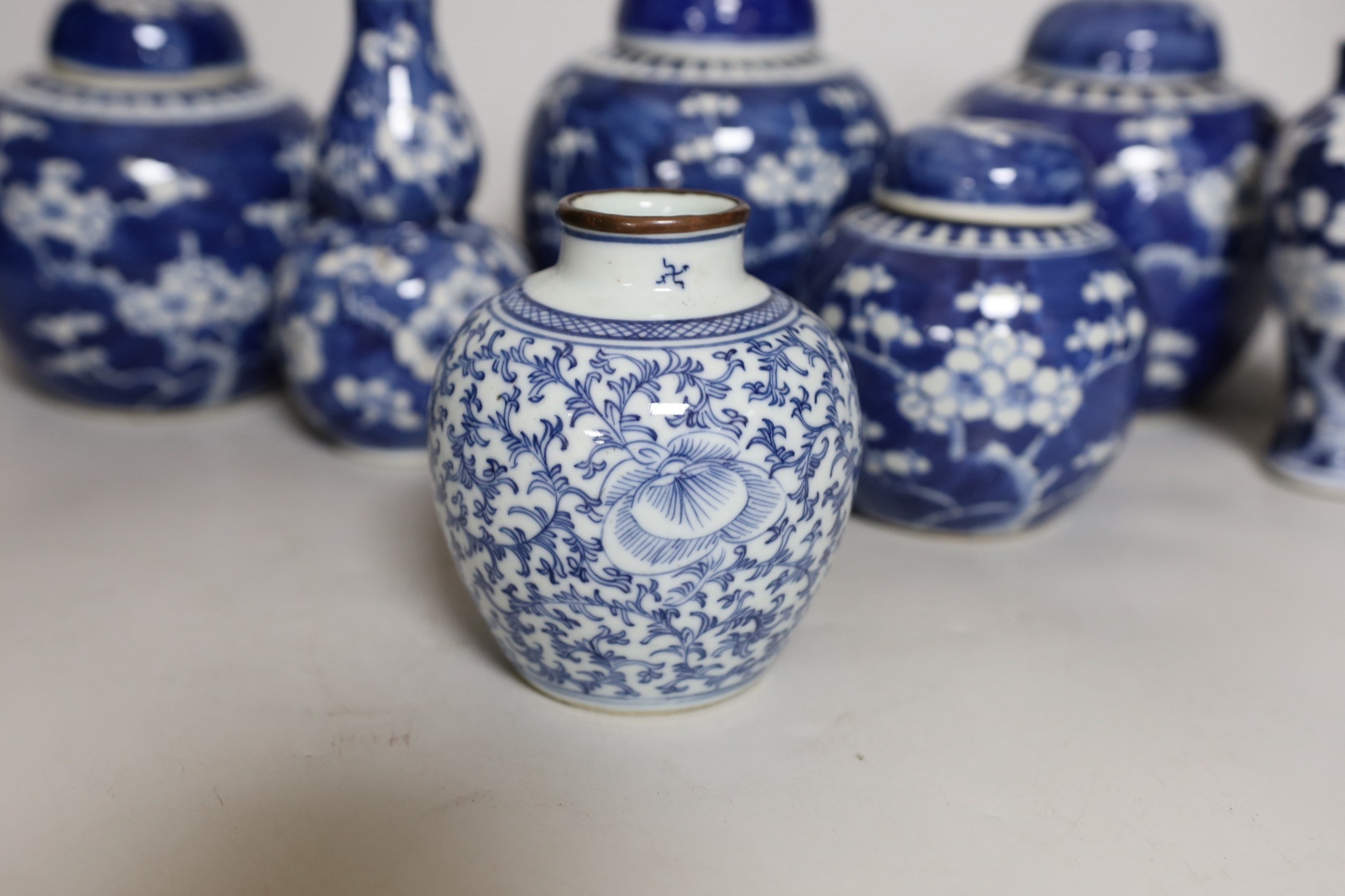 Four Chinese blue and white prunus pattern ginger jars, together with three similar vases. 19th/ - Image 2 of 10