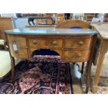 A George III Sheraton period mahogany bow front dressing table, length 112cm, depth 56cm, height
