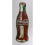 An enamelled Coca-Cola sign in the shape of a bottle, with a thermometer, 43cms high