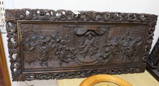 A 17th century style carved oak panel, 'The judgement of Solomon', 95cms wide x 45cms high