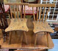 A near pair of 19th century primitive ash and elm Windsor child's chairs, larger width 34cm, depth