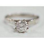 An 18ct white metal and solitaire diamond set ring, size Q, gross weight 4.6 grams, the stone