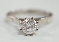 An 18ct white metal and solitaire diamond set ring, size Q, gross weight 4.6 grams, the stone