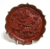 An early 20th century Chinese cinnabar lacquer dish, 29.5cms diameter