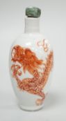 A Chinese rouge-de-fer 'dragon' snuff bottle, late 19th century, 6.7cm Provenance - the former owner