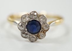 A mid 20th century 18ct & plat, sapphire and diamond set flower head cluster ring, size S, gross
