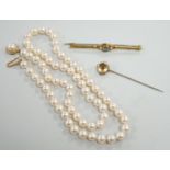 A single strand cultured pearl necklace, with 9ct gold clasp, 46cm, together with a yellow metal and