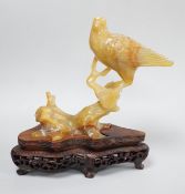 A Chinese chalcedony carving of a bird, wood stand, total height 15.5 cm Provenance - the former