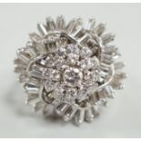 A white metal, baguette and round cut diamond spiral cluster set dress ring, size P, gross