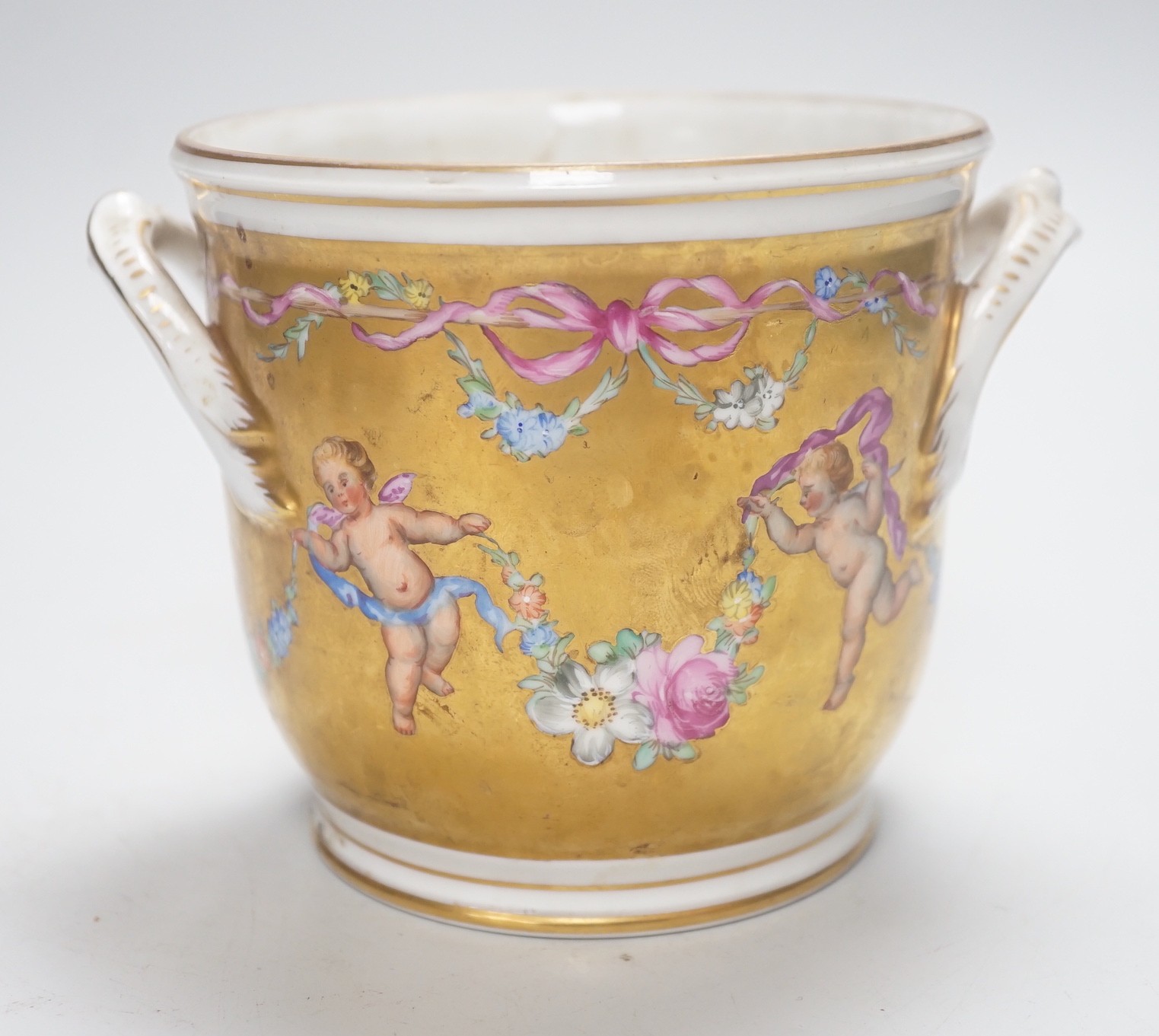 A late 19th century gilded Dresden cherubic jardiniere, 11cm