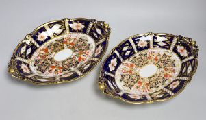 A pair of Royal Crown Derby Imari footed oval dishes, 29cms wide