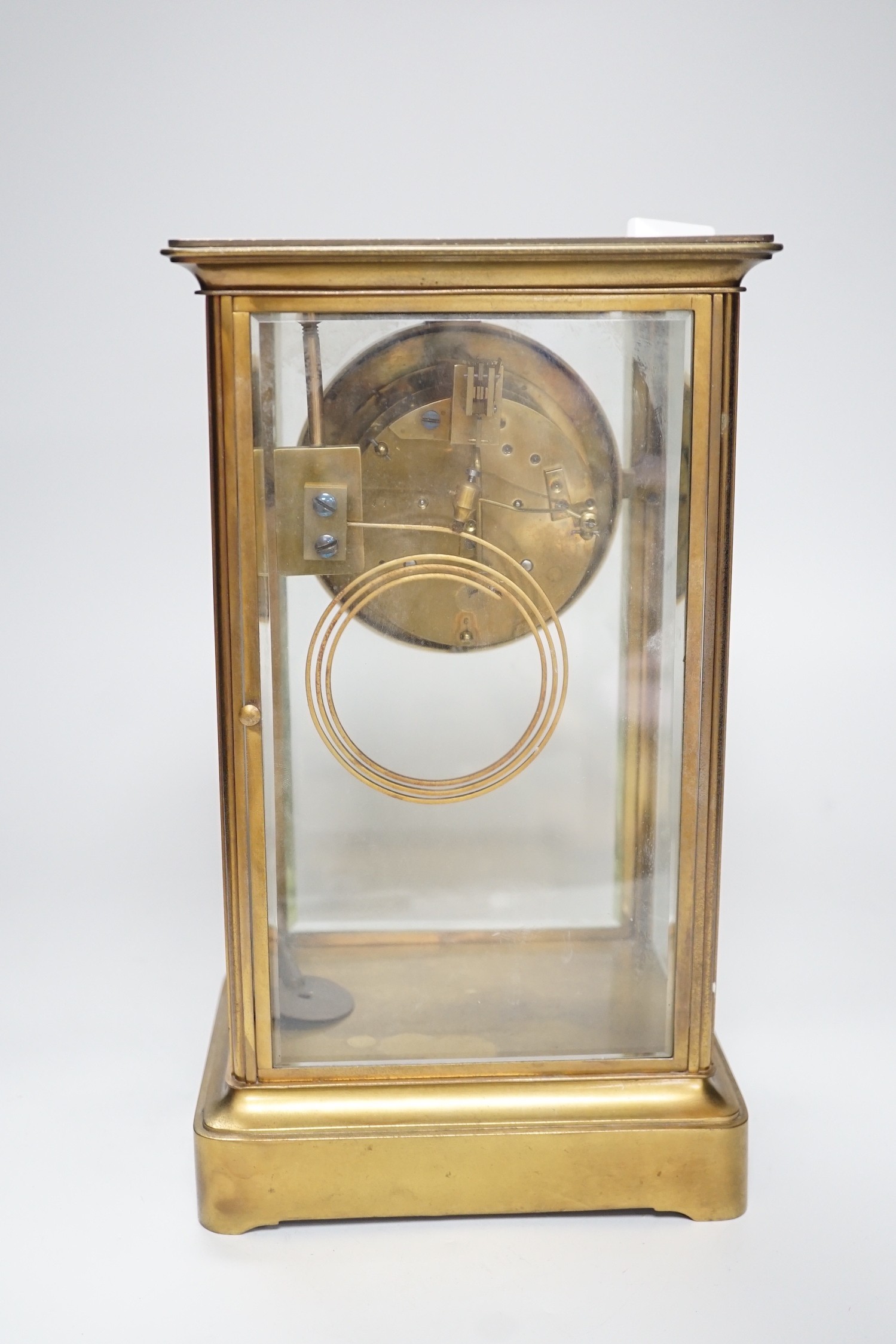 An Edwardian brass four-glass mantel clock with pendulum, presentation plaque to base, 30cm tall - Image 5 of 5