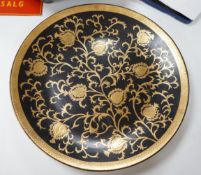 A large gilt and black pottery charger, 50cm diameter