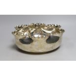 A late Victorian silver circular fruit bowl, with pinched wavy border, by Frederick Elkington,