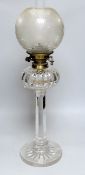 A Victorian clear glass oil lamp. 73cm tall