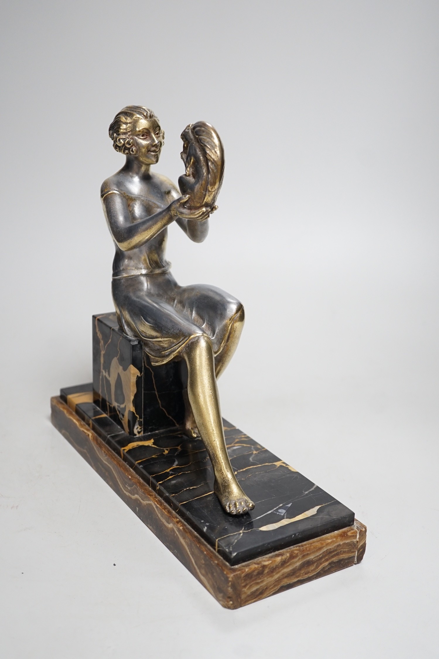 An Art Deco spelter gilded and silvered seated lady holding a squirrel, on marble and onyx mount, - Image 5 of 5