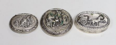 Two 19th century Dutch white metal snuff boxes, circular 56mm and oval and an 800 standard oval