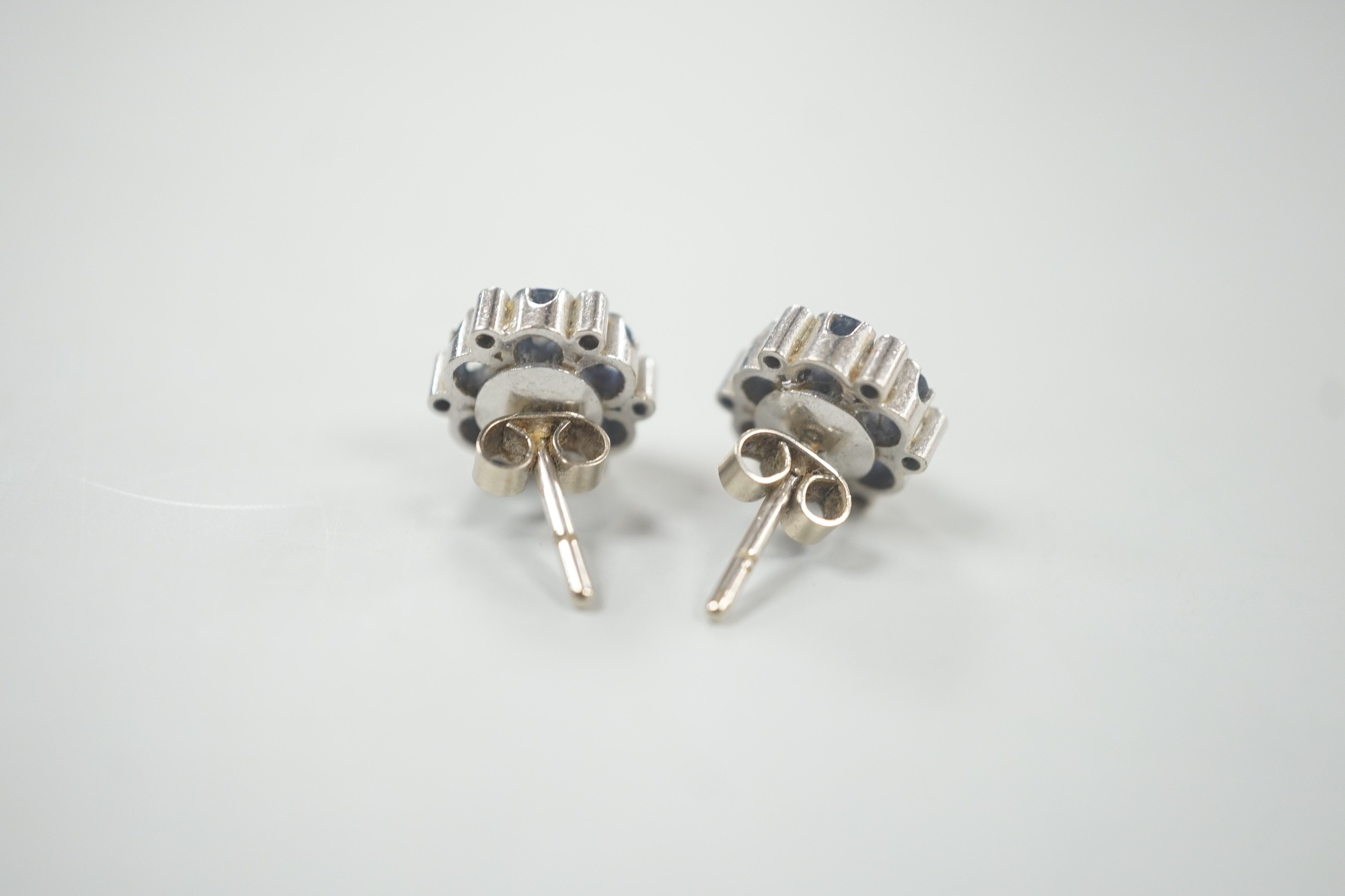 A pair of white metal, sapphire and diamond cluster set flower head ear studs, 10mm, gross weight - Image 2 of 6