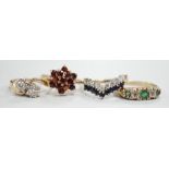 Four assorted modern 9ct gold and gem set rings, including a two stone diamond crossover, size K/