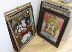 A collection of eight Indian reverse decorated glass pictures, 20th century, largest frame 70cm X