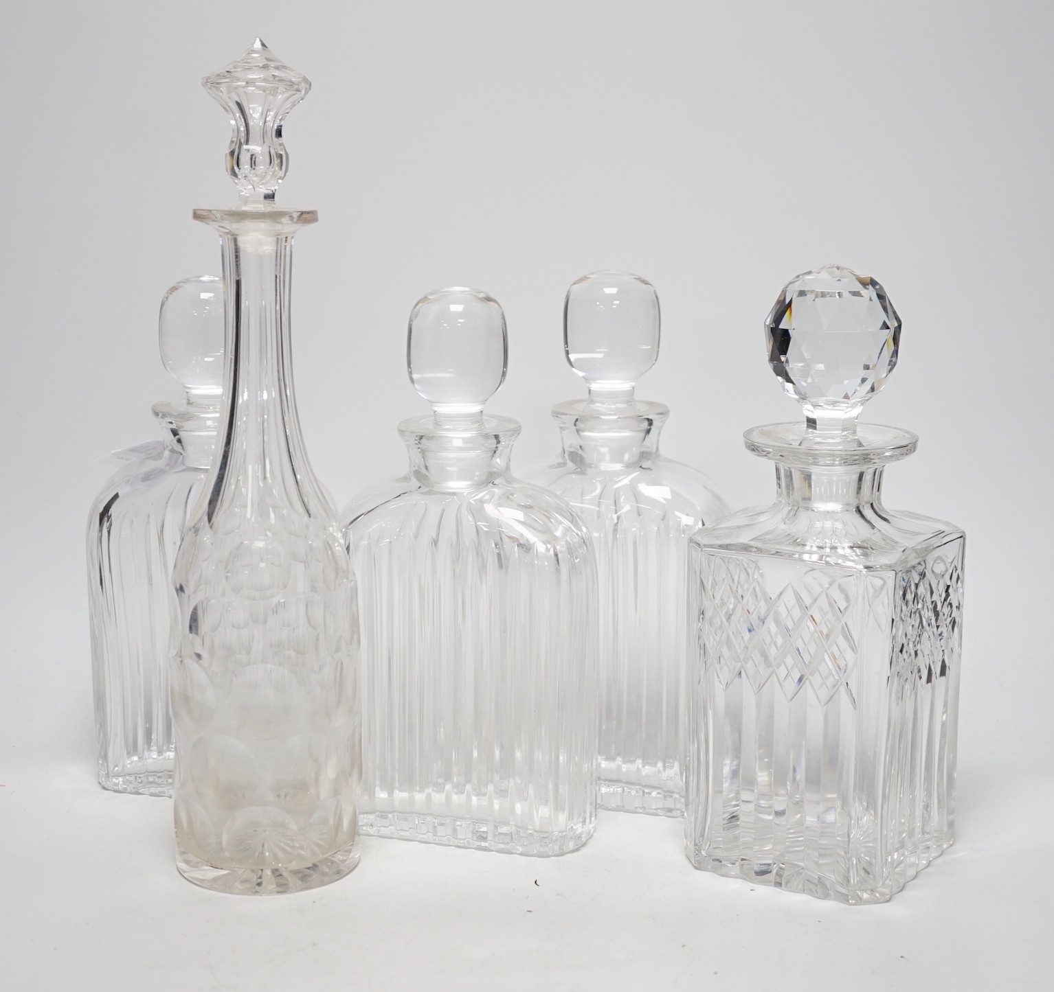 Five 20th century glass decanters, tallest 35cm