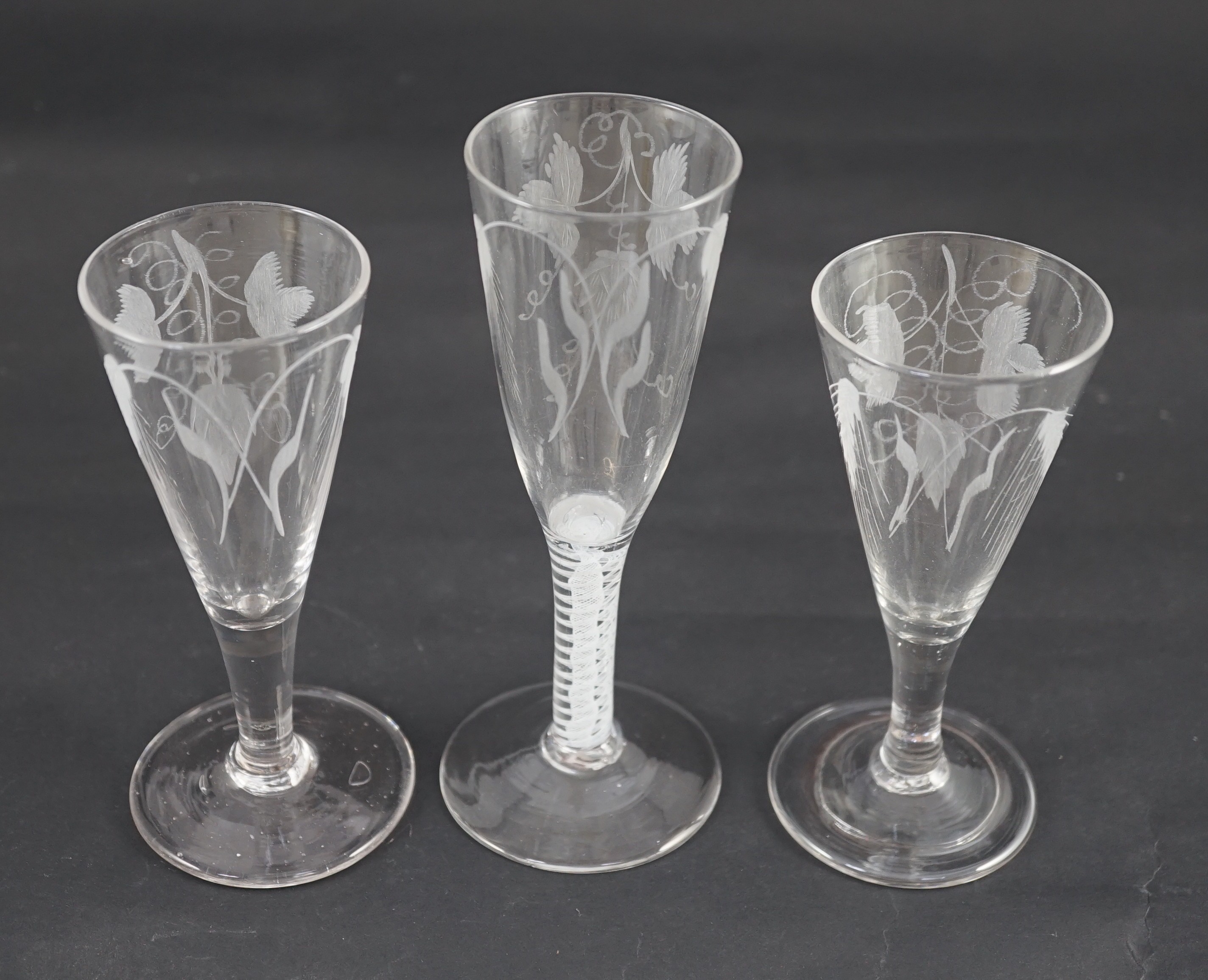 Three ‘hops and barley’ wheel engraved glass ale flutes, mid 18th century, the tallest with double - Image 2 of 6