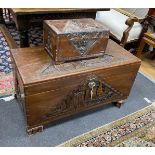 A Chinese carved camphorwood coffer and similar smaller box, larger length 93cm, depth 44cm,