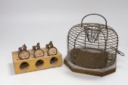 A circular metal mouse trap and a Mermier mouse trap,