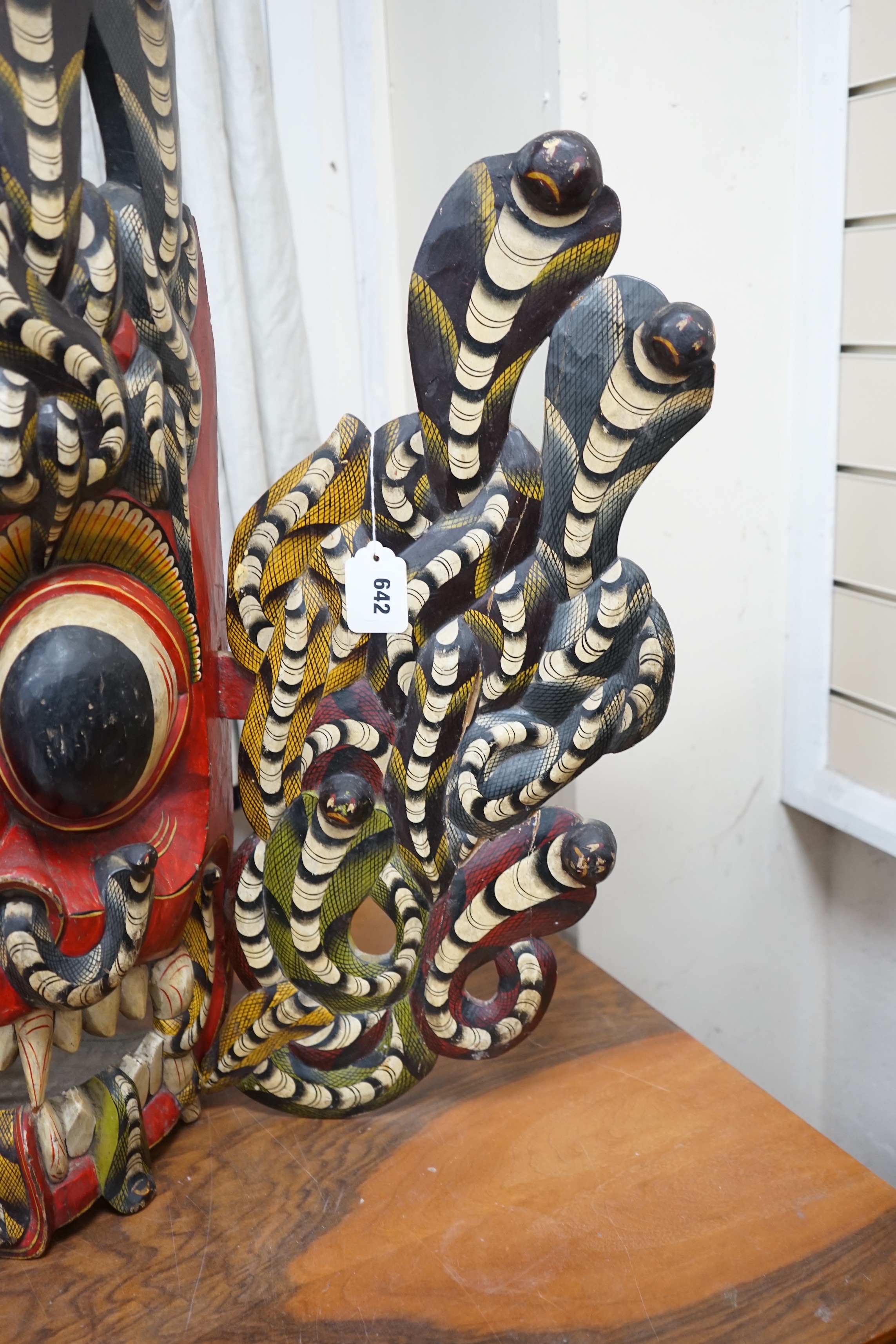 A large interesting Sri-Lankan painted wood Naga Raksha mask, early 20th century, 77cm tall - Image 2 of 3