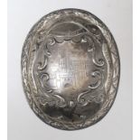 A Victorian silver oval plaque, with engraved inscription relating to 'The Tower of London St.