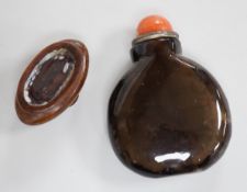 A Chinese smoky quartz snuff bottle, 18th/19th century, well hollowed, 4.7cm, coral stopper