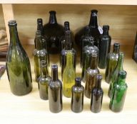 A pair of 18th century green glass onion bottles and a large quantity of other green glass