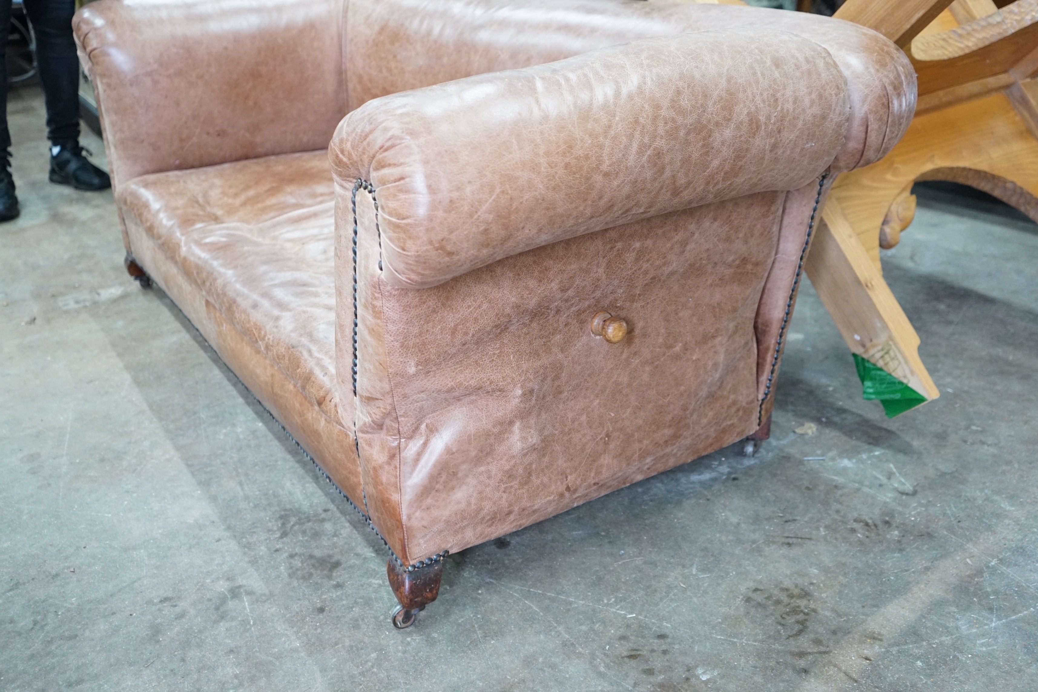 An early 20th century tan leather drop arm Chesterfield settee, width 160cms, depth 84cms, height - Image 2 of 3