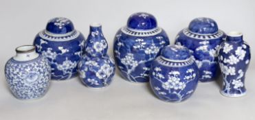 Four Chinese blue and white prunus pattern ginger jars, together with three similar vases. 19th/
