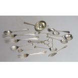 A silver tea strainer and a small collection of assorted 20th century and earlier silver cutlery,
