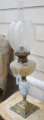 A pair of Art Nouveau decorative porcelain, brass and glass oil lamps. 64cm tall