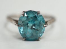 A white metal and blue zircon set ring, size P/Q, gross weight 2.8 grams.