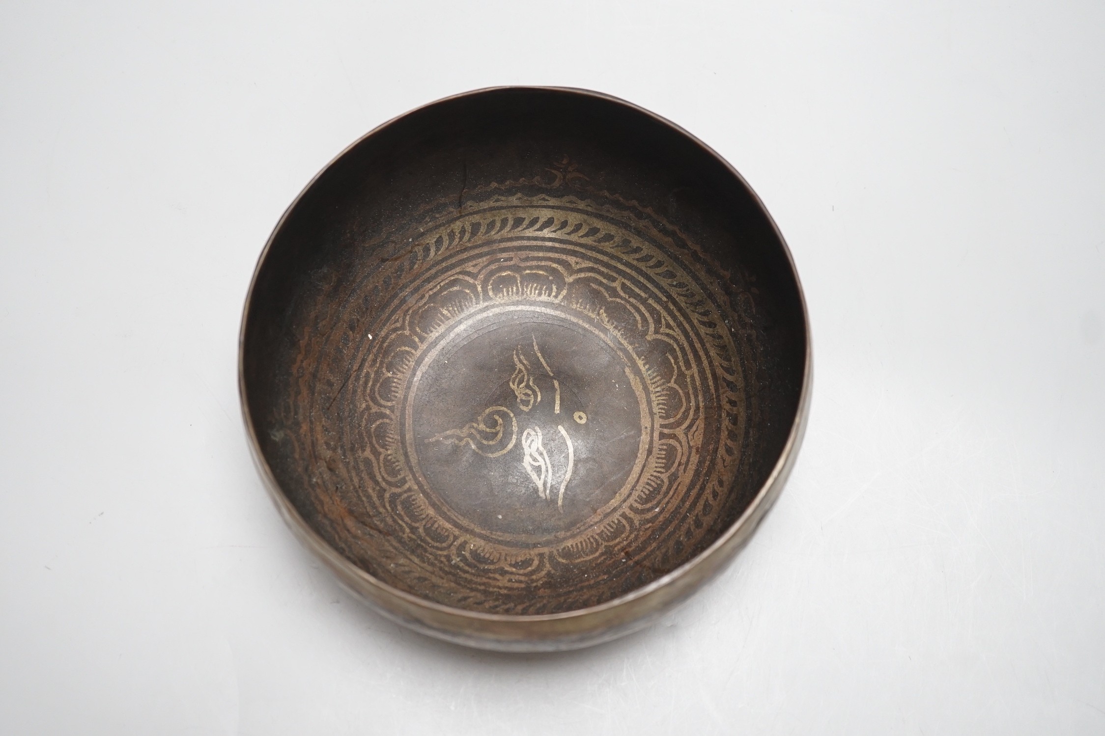 A bronze Nepalese temple bowl decorated with script, 18cm diameter - Image 4 of 5