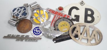 A mixed collection of RAC, AA and other automobile badges.