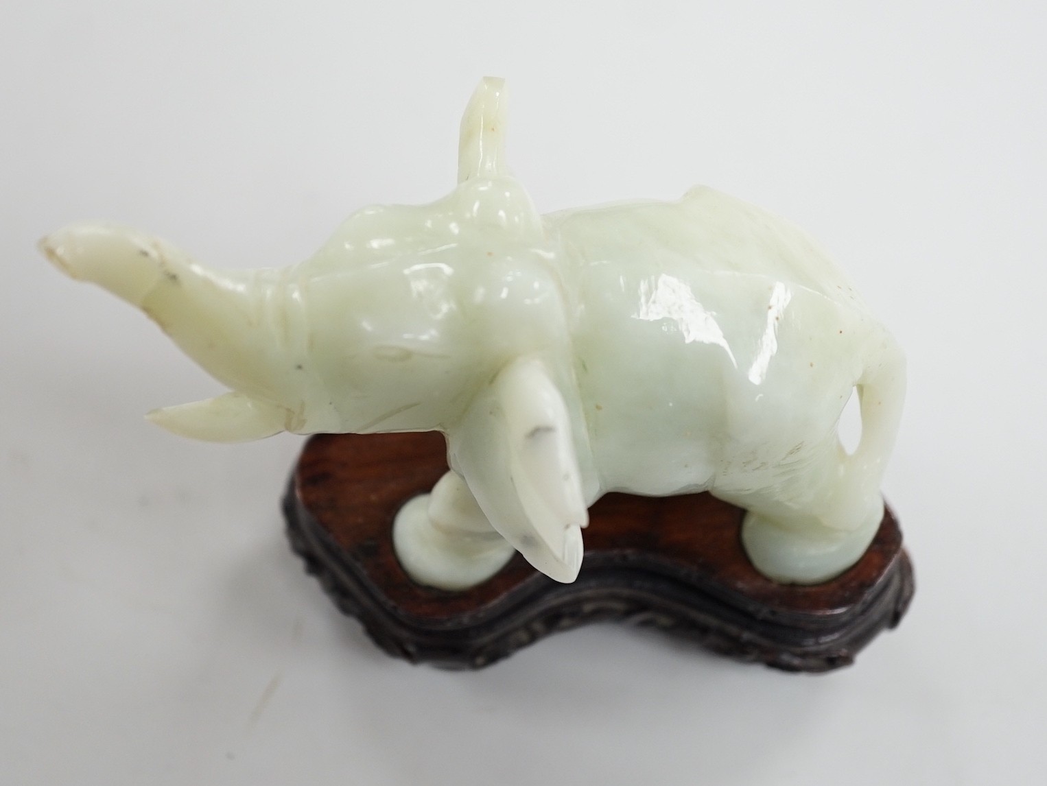 A Chinese bowenite jade elephant on hard wood stand, 11cm tall - Image 6 of 8