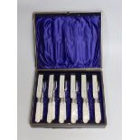 A cased set of six pairs of late Victorian mother of pearl handled silver dessert eaters, P.