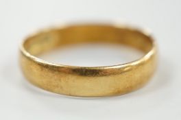 A 1960's 18ct gold wedding band, size P/Q, 3.3 grams, with engraved date to shank interior.