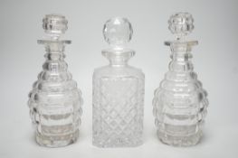 A pair of Victorian cut glass decanters and stoppers and one other, tallest 26cm