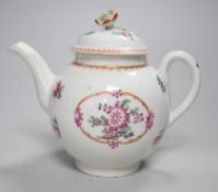 An 18th century Worcester teapot and cover painted in Chinese export style with flowers in an oval