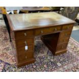 A small William Tillman reproduction George III style mahogany pedestal desk, length 112cm, depth